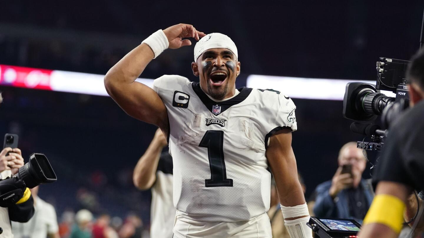 Jalen Hurts, Eagles fend off Commanders in OT to stay undefeated