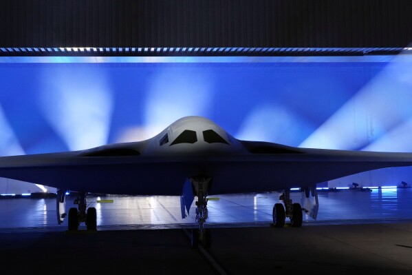 FILE - The B-21 Raider stealth bomber is unveiled at Northrop Grumman, Dec. 2, 2022, in Palmdale, Calif. The B-21 Raider has taken it’s first flight, moving the futuristic warplane closer to becoming the nation’s next nuclear weapons stealth bomber. The Raider flew out of Palmdale, Calif., where it has been under testing and development by Northrop Grumman. (AP Photo/Marcio Jose Sanchez, File)