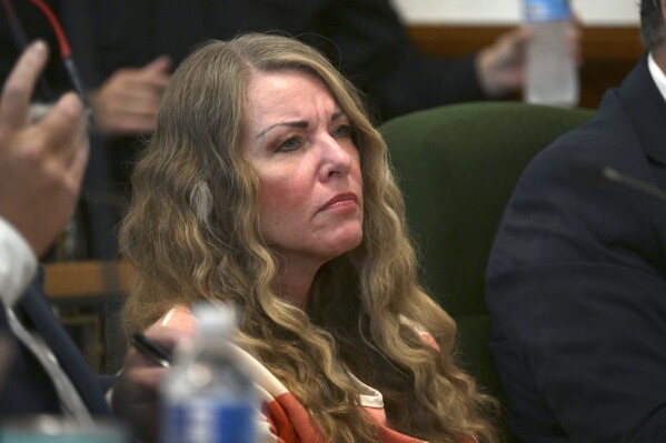 Lori Vallow Daybell sits during her sentencing hearing at the Fremont County Courthouse in St. Anthony, Idaho, Monday, July 31, 2023. The Idaho mother Vallow Daybell has been sentenced to life in prison without parole Monday in the murders of her two youngest children and a romantic rival. The case has included bizarre claims that her son and daughter were zombies and that she was a goddess sent to usher in the Biblical apocalypse. (Tony Blakeslee/EastIdahoNews.com via AP, Pool)
