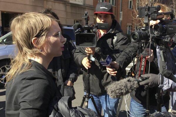 
              In this Tuesday, March 5, 2019 photo, Chelsea Manning addresses the media outside federal court in Alexandria, Va. The former Army intelligence analyst was ordered to jail Friday, March 8, 2019, for refusing to testify to a Virginia grand jury investigating Wikileaks. (AP Photo/Matthew Barakat)
            