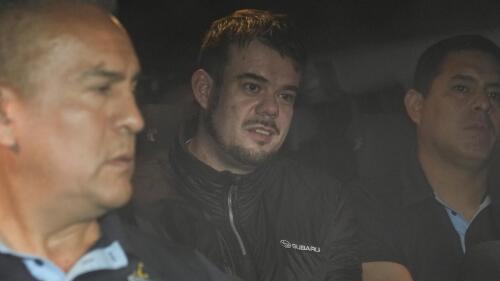 Dutch citizen Joran van der Sloot is driven in a police vehicle from the Ancon I maximum-security prison, outskirts of Lima, Peru, Thursday, June 8, 2023. The main suspect in the unsolved 2005 disappearance of American student Natalee Holloway on the Caribbean island of Aruba is expected to be extradited Thursday from Peru to the United States. (AP Photo/Martin Mejia)