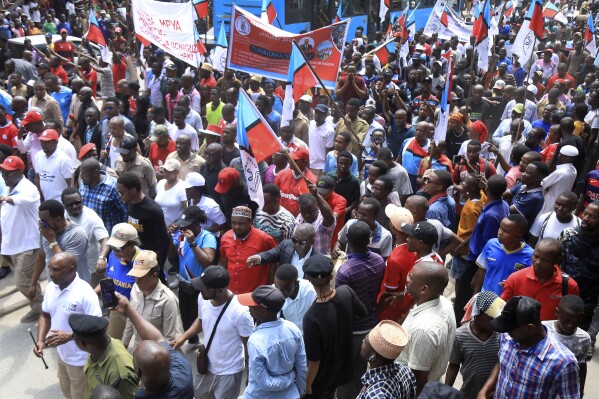 Hundreds of supporters of Tanzania's main opposition party, CHADEMA, protest in Dar es Salaam, Tanzania, Wednesday, Jan. 24, 2024. The party is demanding a change in the constitution to allow presidential election results to be challenged in court and similar changes to be included in amendments in electoral laws that were tabled in parliament in November. It was the first time in seven years that leaders of an opposition group had been allowed by to hold a major demonstration. (AP Photo)