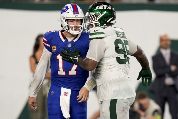 New York Jets defensive end Will McDonald IV (99) pushes Buffalo Bills quarterback Josh Allen (17) in overtime of an NFL football game, Monday, Sept. 11, 2023, in East Rutherford, N.J. (AP Photo/Seth Wenig)