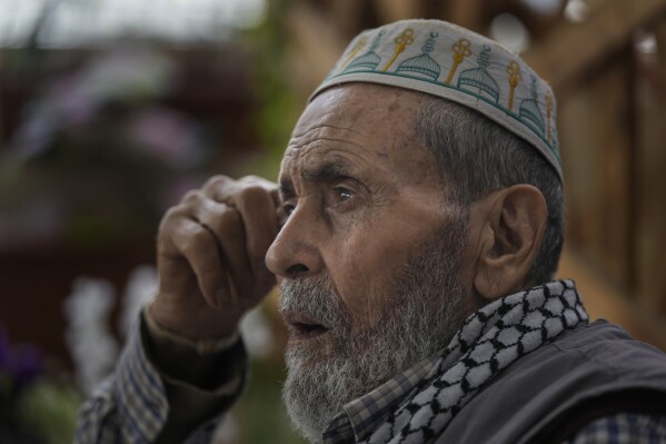 Mahmoud Ismail, 86, gestures as he speaks during an interview with the Associated Press in the center of the Social Support NGO at the Palestinian refugee camp of Shatila in Beirut, Lebanon, May 15, 2024. (AP Photo/Hassan Ammar)