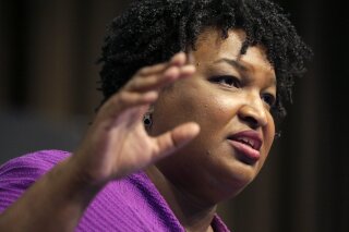 FILE - In this April 3, 2019, file photo, former Georgia gubernatorial candidate Stacey Abrams speaks during the National Action Network Convention in New York. Abrams, whose voting rights work helped make Georgia into a swing state, exhorted Congress on Thursday, Feb. 25, 2021, to reject “outright lies" that have historically restricted access to the ballot as Democrats began their push for a sweeping overhaul of election and ethics laws. (AP Photo/Seth Wenig, File)