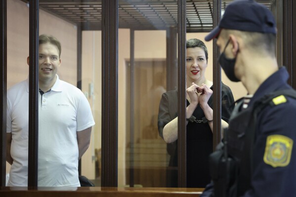 FILE - Belarus opposition activists Maria Kolesnikova, right, and Maxim Znak attend a court hearing in Minsk, Belarus, on Monday, Sept. 6, 2021. It's been a year since Kolesnikova last wrote a letter to her family from behind bars, according to her father. No one has seen or heard from Kolesnikova, who is serving 11 years in prison for organizing anti-government rallies, since Feb. 12, 2023. (Ramil Nasibulin/BelTA pool photo via AP, File)