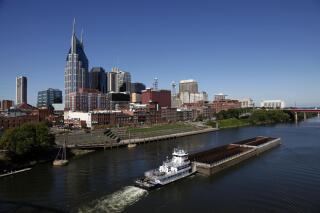 FILE - This Sept. 27, 2011 file photo shows the Cumberland River and downtown Nashville, Tenn. Tennessee paid thousands of dollars for social media influencers to promote a contentious new initiative that uses $2.5 million in taxpayer dollars to offer flight vouchers largely to out-of-state residents. According to documents obtained through a public records request, the Department of Tourist Development paid an estimated $11,000 to at least 11 local influencers to post on Instagram, Facebook and TikTok touting the new program. (AP Photo/Mark Humphrey, File)