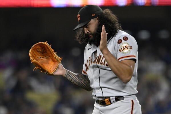 San Francisco Giants starting pitcher Sean Manaea applauds after getting Los Angeles Dodgers' Amed Rosario to fly out to left field during the seventh inning of a baseball game in Los Angeles, Friday, Sept. 22, 2023. (AP Photo/Alex Gallardo)