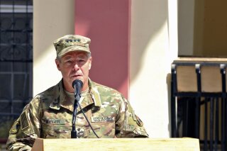 
              In this September 2, 2018 photo, provided by the U.S. Air Force, U.S. Army Gen. Scott Miller, commander of U.S. and NATO troops in Afghanistan, delivers remarks during the Resolute Support mission change of command ceremony in Kabul, Afghanistan. Afghan officials said Thursday, Oct. 18, 2018 that three top Kandahar province officials have been killed by their own guards in an attack at a security meeting that also wounded two U.S. troops. A Taliban spokesman who claimed responsibility for the attack tells The Associated Press that Miller, was the target. NATO officials say Miller escaped unharmed. (U.S. Air Force/Tech. Sgt. Sharida Jackson, via AP)
            