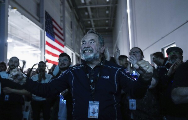 Main Engine Control Computer designer for Intuitive Machines Dan Harrison cheers amongst fellow employees during a watch party moments after they became the first commercial company to softly land on the moon on Thursday, Feb. 22, 2024, in Houston. ( Raquel Natalicchio/Houston Chronicle via AP)