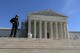 A U.S. Supreme Court police officer stands in fron of the U.S. Supreme Court Wednesday, Feb. 7, 2024, in Washington. The Supreme Court hears arguments on Feb. 8 over whether former President Donald Trump can be kept off the ballot because of his efforts to overturn the 2020 election results, culminating in the Jan. 6, 2021 attack on the Capitol. (AP Photo/Jose Luis Magana)