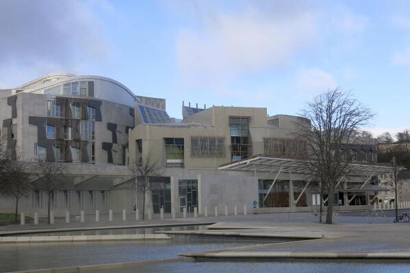 FILE - This file photo taken March 16, 2014 shows a general view of the Scottish Parliament in Edinburgh, Scotland. A law has come into force in Scotland to ensure period products are available free of charge to anyone who needs them. The Scottish government said it became the first in the world to legally protect the right to access free period products when its Period Products Act came into force Monday. (AP Photo/Jill Lawless, File)