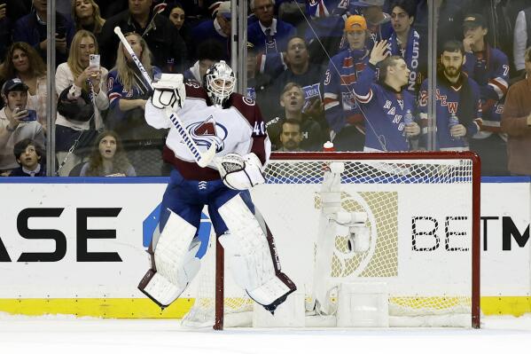 Colorado Avalanche goaltender Alexandar Georgiev celebrates after making a save against New York Rangers left wing Alexis Lafrenière to end a shoot out in an NHL hockey game Tuesday, Oct. 25, 2022, in New York. The Avalanche won 3-2 in a shootout. (AP Photo/Adam Hunger)