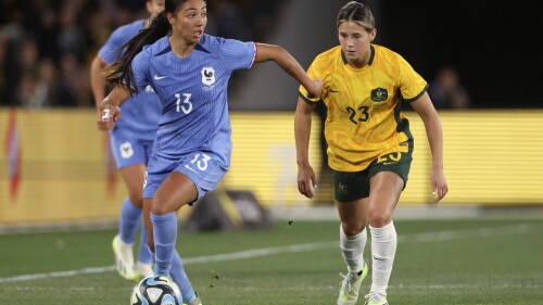 France's Selma Bacha, left, and Australia's Kyra Cooney-Cross compete for the ball during their friendly soccer match in Melbourne, Friday, July 14, 2023, ahead of the Women's World Cup. (AP Photo/Hamish Blair)