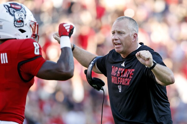 North Carolina State head coach Dave Doeren reacts following a defensive stop of Clemson during the second half of an NCAA college football game in Raleigh, N.C., Saturday, Oct. 28, 2023. (AP Photo/Karl B DeBlaker)