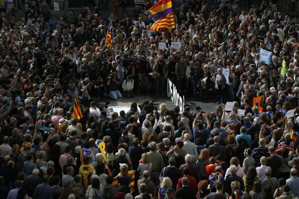 
              Thousands of people rally outside the regional presidential palace in Sant Jaume Square to show their support for those appearing in court, in Barcelona, Spain, Thursday, Nov. 2, 2017. Spain's National Court in Madrid was questioning ousted Catalan government members Thursday in an investigation into possible rebellion charges for having declared the region's independence, while a parallel Supreme Court session for six Catalan lawmakers was suspended for a week. (AP Photo/Manu Fernandez)
            
