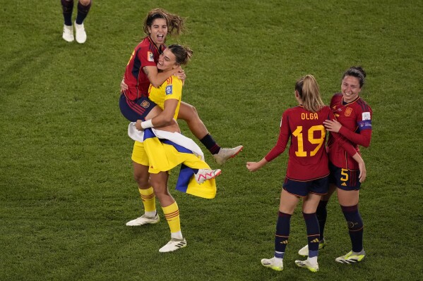 Fromleft to right, Alba Redondo, Misa Rodriguez, Olga Carmona and Ivana Andres celebrate after defeating England during the Women's World Cup soccer final at Stadium Australia in Sydney, Australia, Sunday, Aug. 20, 2023. (AP Photo/Mark Baker)