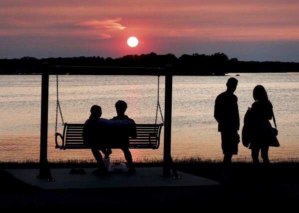 Smoke from Canadian wildfires is visible at sunset in Oconomowoc, Wis., June 1, 2025. (John Hart/Wisconsin State Journal via AP)