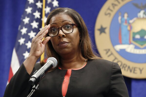 FILE - In this Aug. 6, 2020, file photo, New York State Attorney General Letitia James adjusts her glasses during a press conference in New York. New York may have undercounted COVID-19 deaths of nursing home residents by as much as 50%, the state’s attorney general said in a report released Thursday, Jan. 28, 2021.  James has, for months, been examining discrepancies between the number of deaths being reported by the state’s Department of Health, and the number of deaths reported by the homes themselves. (AP Photo/Kathy Willens, File)