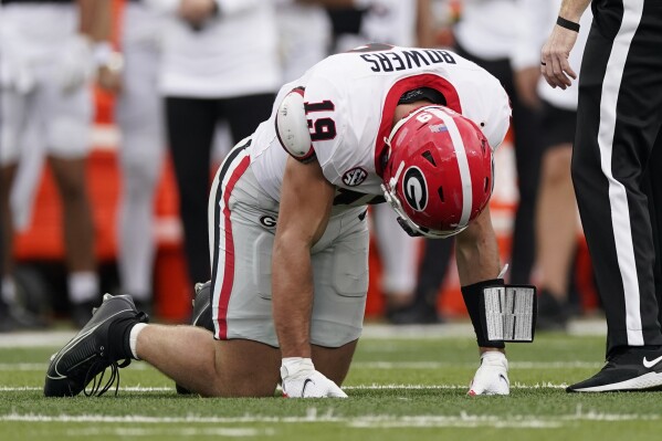 News is TE ankle least AP sidelined having a likely He Brock Bowers be month Georgia will at | surgery.