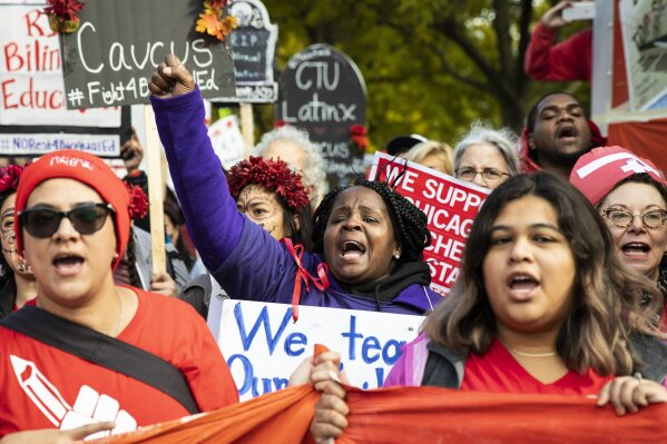 Thousands of Chicago Teachers Union members and their supporters march through the Near West Side after a rally in Union Park on day five of a Chicago Public Schools district-wide strike, Monday afternoon, Oct. 21, 2019. (Ashlee Rezin Garcia/Chicago Sun-Times via AP)