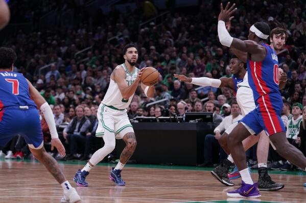 Boston Celtics forward Jayson Tatum (0) takes a shot against the Detroit Pistons during first half of an NBA basketball game, Wednesday, Nov. 9, 2022, in Boston. (AP Photo/Charles Krupa)