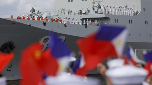 Chinese navy sailors wave as they arrive on board their naval training ship, Qi Jiguang, for a goodwill visit at Manila's port, Philippines Wednesday, June 14, 2023. The Chinese navy training ship made a port call in the Philippines on Wednesday, its final stop on a goodwill tour of four countries as Beijing looks to mend fences in the region. (AP Photo/Basilio Sepe)