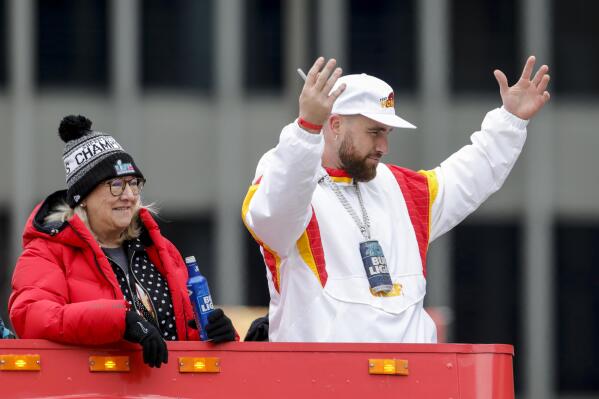 Travis Kelce, right, and his mother Donna Kelce, left, take part in the Kansas City Chiefs' victory celebration and parade in Kansas City, Mo., Wednesday, Feb. 15, 2023, following the Chiefs' win over the Philadelphia Eagles Sunday in the NFL Super Bowl 57 football game. (AP Photo/Colin E. Braley)