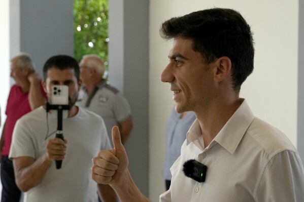 Popular YouTuber and TikToker with millions of online followers Fidias Panayiotou proclamation as the winner of one of six seats allotted to Cyprus in the European Parliament, arrives at the Filoxenia Conference Center in the capital Nicosia, Cyprus, on Tuesday, June 11, 2024. The 24-year-old Cypriot says he will continue using social media in his new job as a member of the European Parliament because he sees it as 