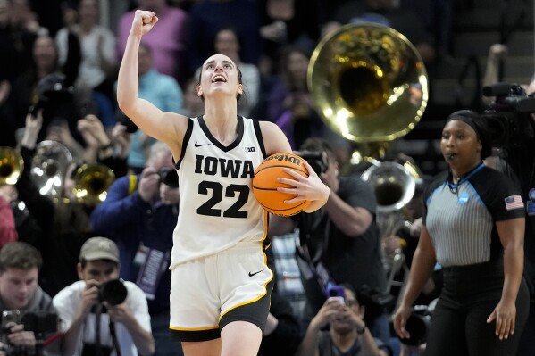 Iowa guard Caitlin Clark (22) celebrates after defeating LSU in an Elite Eight round college basketball game during the NCAA Tournament, Monday, April 1, 2024, in Albany, N.Y. (AP Photo/Mary Altaffer)