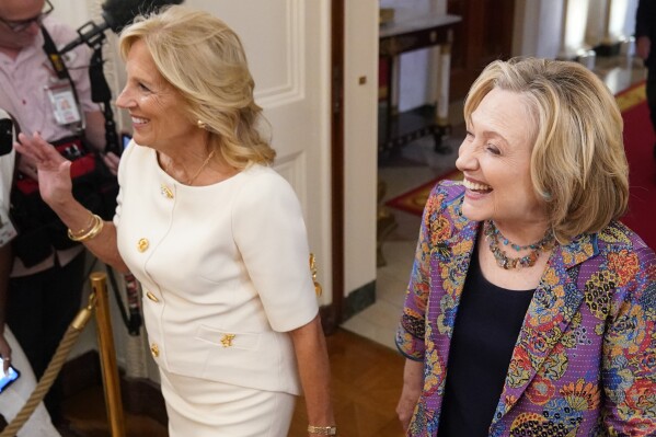 First lady Jill Biden and former Secretary of State Hillary Clinton arrive to speak during an event to celebrate the 2023 Praemium Imperiale Laureates, a global arts prize awarded annually by the Japan Art Association for lifetime achievement in the arts, in the East Room of the White House, Tuesday, Sept. 12, 2023, in Washington. (AP Photo/Alex Brandon)
