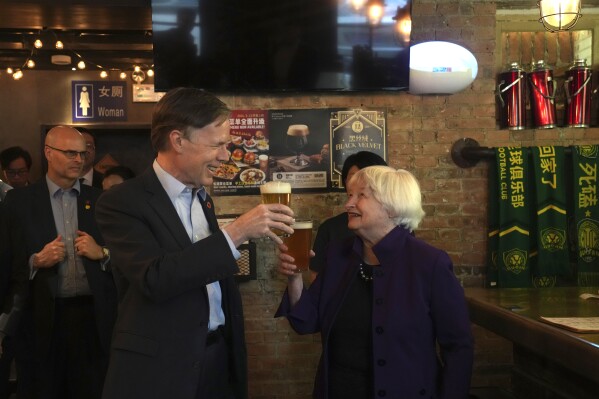 U.S. Treasury Secretary Janet Yellen, right, and U.S. Ambassador to China Nicholas Burns sample beer at the Jing-A brewery in Beijing, China, Monday, April 8, 2024. Treasury Secretary Yellen says the Biden administration will push China to change an industrial policy that poses a threat to U.S. jobs. (AP Photo/Tatan Syuflana, Pool)