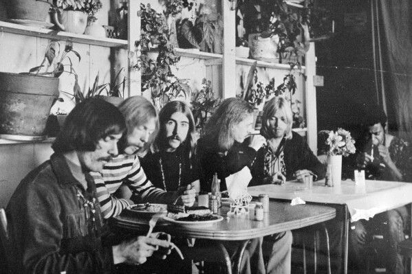 FILE - This undated photo shows members of the Allman Brothers Band, from left, Dickey Betts, Duane Allman, Berry Oakley, Butch Trucks, Gregg Allman and Jai Johanny "Jaimoe" Johanson, eating at the H&H Restaurant in downtown Macon, Ga. Guitar legend Betts, who co-founded the Allman Brothers Band and wrote their biggest hit, “Ramblin’ Man,” died Thursday, April 18, 2024. He was 80. (The Macon Telegraph via AP, File)
