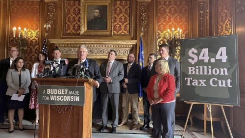 Wisconsin state Sen. Howard Marklein, surrounded by Republican lawmakers, discusses $4.4 billion in GOP tax cuts, including a $3.5 billion income tax cut, that are part of the state budget unveiled on Thursday, June 22, 2023, at a news conference in the state Capitol in Madison, Wis. (AP Photo/Scott Bauer)