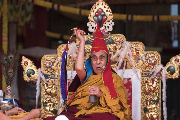 In this Monday, April 10, 2017 file photo, Tibetan spiritual leader the Dalai Lama, performs a ritual during the day's teachings in Tawang, in the northeastern state of Arunachal Pradesh, India. More than 150 Tibetan religious leaders say their spiritual leader, the Dalai Lama, should have the sole authority to choose his successor. A resolution adopted by the leaders at a conference on Wednesday, Nov. 27, 2019, says the Tibetan people will not recognize a candidate chosen by the Chinese government for political ends. (AP Photo/Tenzin Choejor, File)