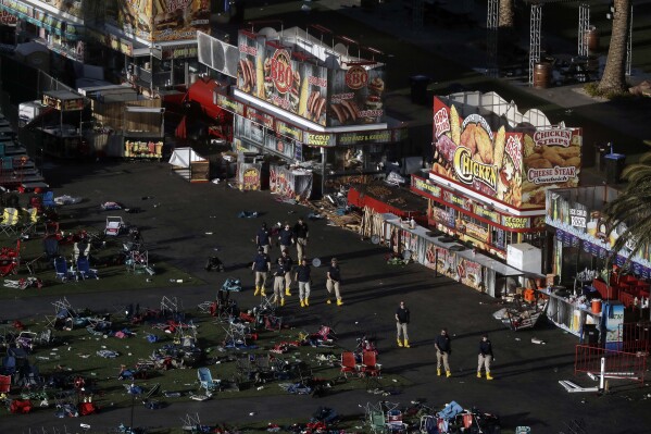 FILE - Investigators work the site of a mass shooting at the Route 91 Harvest Festival on the Las Vegas Strip, Oct. 3, 2017, in Las Vegas. The U.S. Supreme Court, Friday, June 14, 2024, struck down a ban on the rapid-fire rifle bump stock used by the gunman who rattled off over 1,000 bullets in 11 minutes in Las Vegas in 2017. (AP Photo/Marcio Jose Sanchez, File)