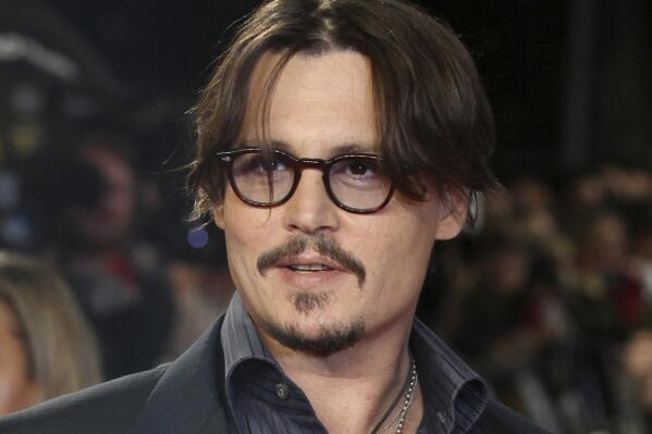 FILE - Actor Johnny Depp appears for the European premiere of their film, "The Rum Diary," in London on Nov. 3, 2011. The historical drama, “Jeanne du Barry,” starring Depp as King Louis XV, will open the 76th Cannes Film Festival. (AP Photo/Joel Ryan, File)