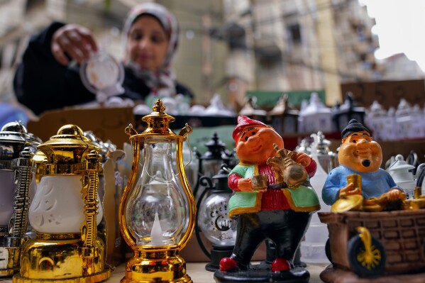 A woman shops for decorations for the Muslim holy month of Ramadan at a shop in Beirut, Lebanon, Saturday, March 9, 2024. (AP Photo/Bilal Hussein)