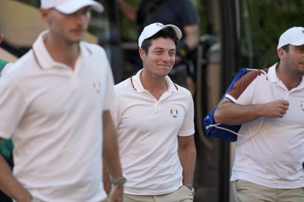 Viktor Hovland of the Ryder Cup team Europe, center, returns with his teammates to a hotel in Rome, Monday, Sept. 11, 2023, at the end of a practice session at the Marco Simone golf club where the 2023 Ryder Cup will be played starting next Sept. 29. (AP Photo/Andrew Medichini)