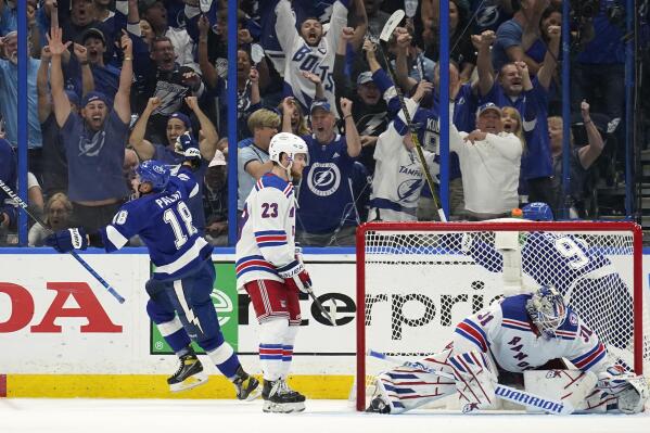 Tampa Bay Lightning left wing Ondrej Palat (18) reacts after scoring past New York Rangers goaltender Igor Shesterkin (31) during the third period in Game 3 of the NHL hockey Stanley Cup playoffs Eastern Conference finals Sunday, June 5, 2022, in Tampa, Fla. (AP Photo/Chris O'Meara)