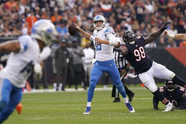 Detroit Lions quarterback Jared Goff passes under pressure by Chicago Bears defensive tackle Bilal Nichols during the first half of an NFL football game Sunday, Oct. 3, 2021, in Chicago. (AP Photo/Nam Y. Huh)