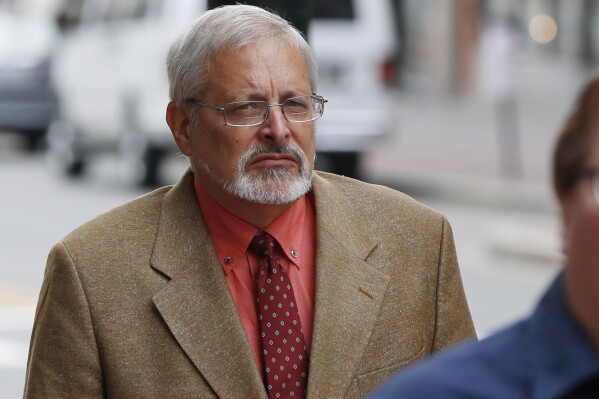 FILE - Michael Geilenfeld arrives at U.S. Bankruptcy Court, July 9, 2015, in Portland, Maine. Geilenfeld, the American founder of a Haitian orphanage who had charges of sexual abuse against him dropped in the island nation, was set to appear in federal court Thursday, Jan. 25, 2024, on new charges brought by U.S. authorities. (AP Photo/Robert F. Bukaty, File)
