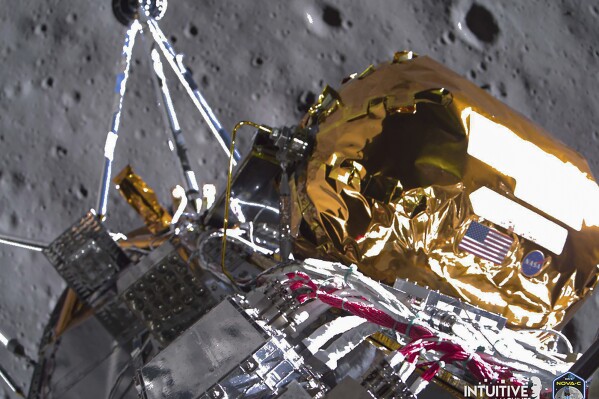 This image provided by Intuitive Machines on Tuesday, Feb. 27, 2024 shows its Odysseus lunar lander over the south pole region of the Moon. The toppled lunar lander is still beaming back pictures of the moon, as its nears the final hours of its life. The photos were taken shortly before last Thursday's touchdown. (Intuitive Machines via AP)