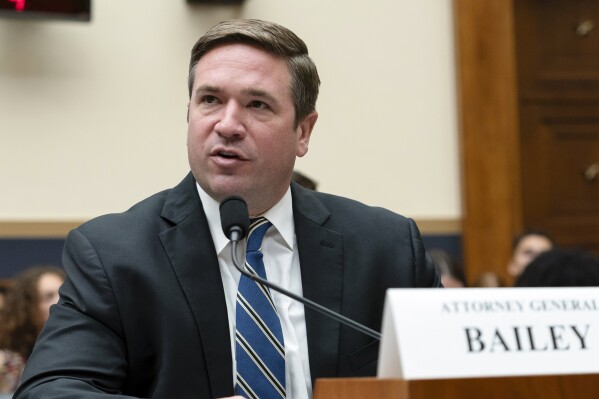 FILE - Missouri Attorney General Andrew Bailey testifies before the House Judiciary Committee hearing on the Manhattan District Attorney's Office, June 13, 2024, on Capitol Hill in Washington. A transgender woman's use of the women's locker room at a suburban St. Louis gym is prompting protests and calls for an investigation. (AP Photo/Jose Luis Magana, File)