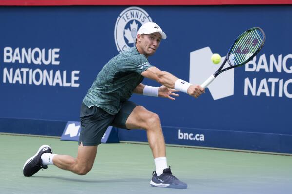 Casper Ruud, of Norway, returns to Roberto Bautista Agut, of Spain, during the round of sixteen at the National Bank Open tennis tournament, Thursday, Aug, 11, 2022, in Montreal. (Paul Chiasson/The Canadian Press via AP)