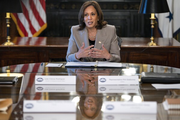 FILE - Vice President Kamala Harris is reflected in a table as she speaks while meeting with state legislators about protecting reproductive rights, Friday, July 8, 2022, in her ceremonial office inside the Eisenhower Executive Office Building on the White House complex in Washington. (AP Photo/Jacquelyn Martin, File)