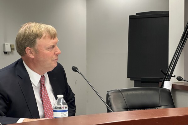 Benjamin Tarbutton III, the president of the Sandersville Railroad, testifies on Monday, Nov. 27, 2023, during a Public Service Commission hearing in Atlanta. The railroad is seeking permission to condemn property to build a 4.5-mile railroad line near Sparta, Ga., over opposition from property owners (AP Photo/Jeff Amy)