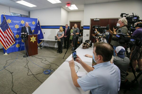 York County Sheriff Kevin Tolson reads a statement from the victims' families during a press conference on Thursday, April 8, 2021, in York, S.C., where he addressed the mass shooting by former NFL football player Phillip Adams. (AP Photo/Nell Redmond)