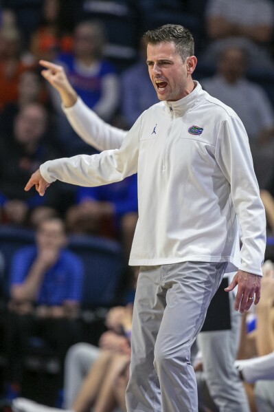 Florida coach Todd Golden agrees to a 2-year extension that includes a $1M raise, AP source says | AP News