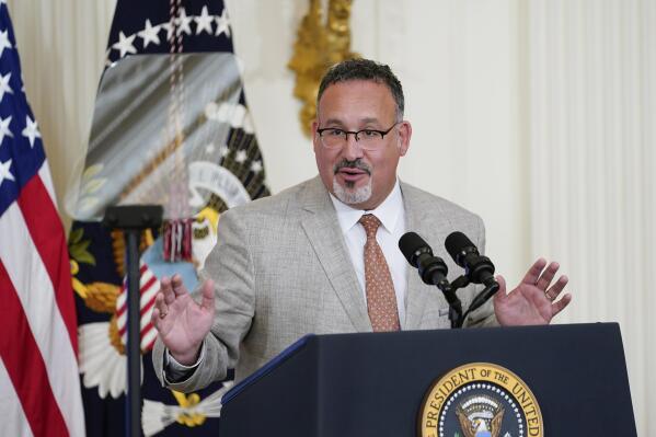 FILE - Education Secretary Miguel Cardona speaks during the 2022 National and State Teachers of the Year event in the East Room of the White House in Washington, April 27, 2022. Cardona said Thursday, May 26, that he's ashamed that the country is "becoming desensitized to the murder of children” and that action is needed now to prevent more lives from being lost in school shootings like the one in Uvalde, Texas. (AP Photo/Susan Walsh, File)